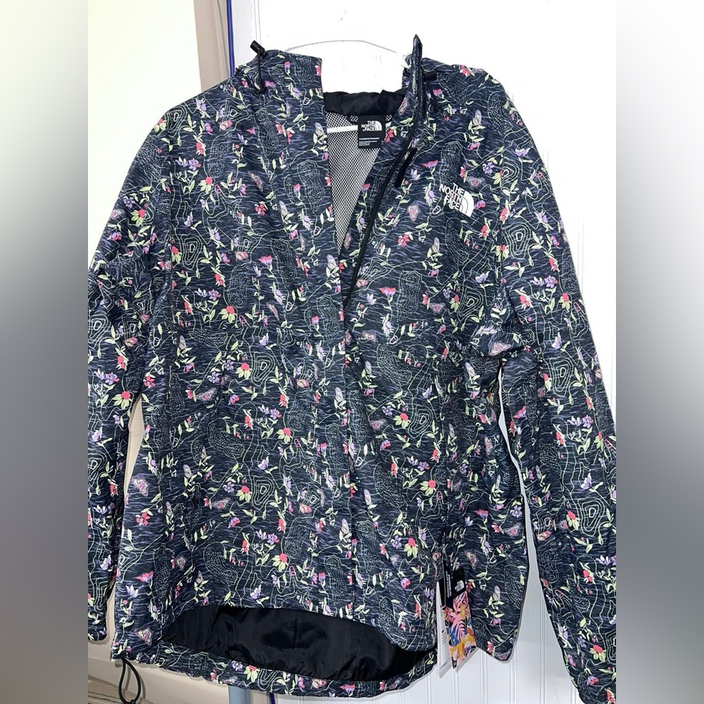 Antora Jacket with a black floral print.